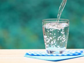Glass of water on a table.